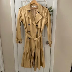 Stylish raincoat. Worn a handful of times. No rips, stains or wear.